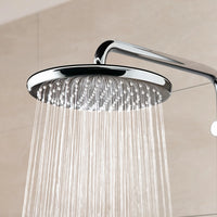 MaxxiBath stainless steel rainfall showerhead with a sleek chrome finish, providing a luxurious water flow for a spa-like shower experience in a modern bathroom.